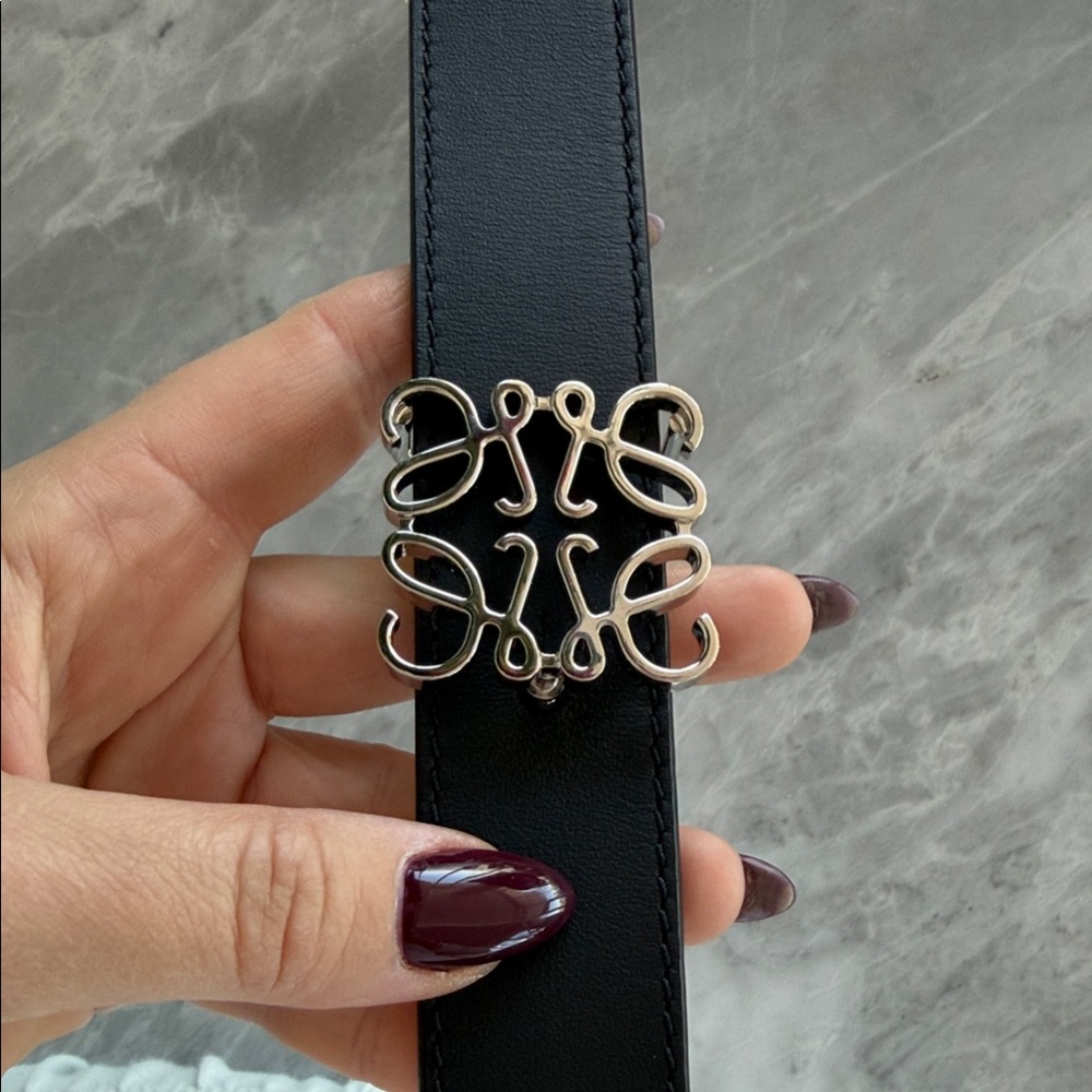 Black Leather Belt with Decorative Silver Buckle